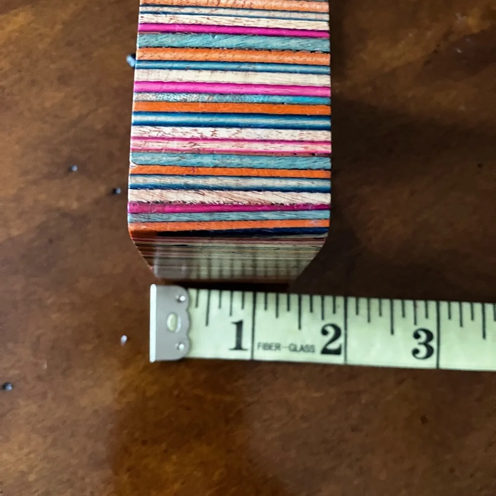 Set of 8 Multicolored Striped Wooden Napkin Rings. Napkin is not included.